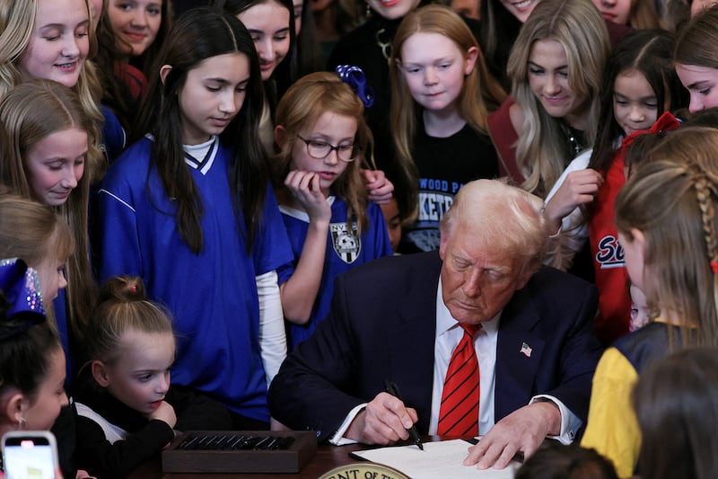 U.S. President Donald Trump signs an executive order banning transgender girls and women from participating in women's sports
