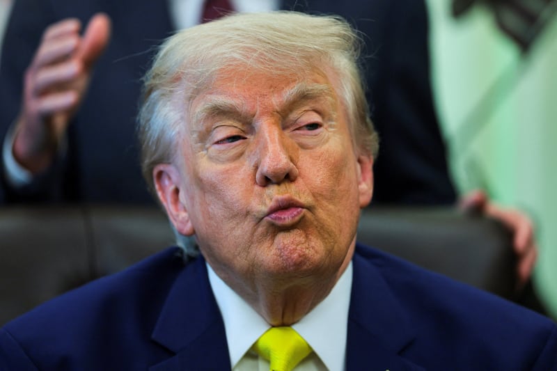 U.S. President Donald Trump reacts