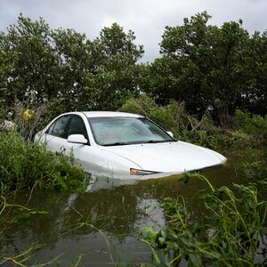 A vehicle is partially submerged after the arrival of Hurricane Idalia, in Cedar Key, Florida