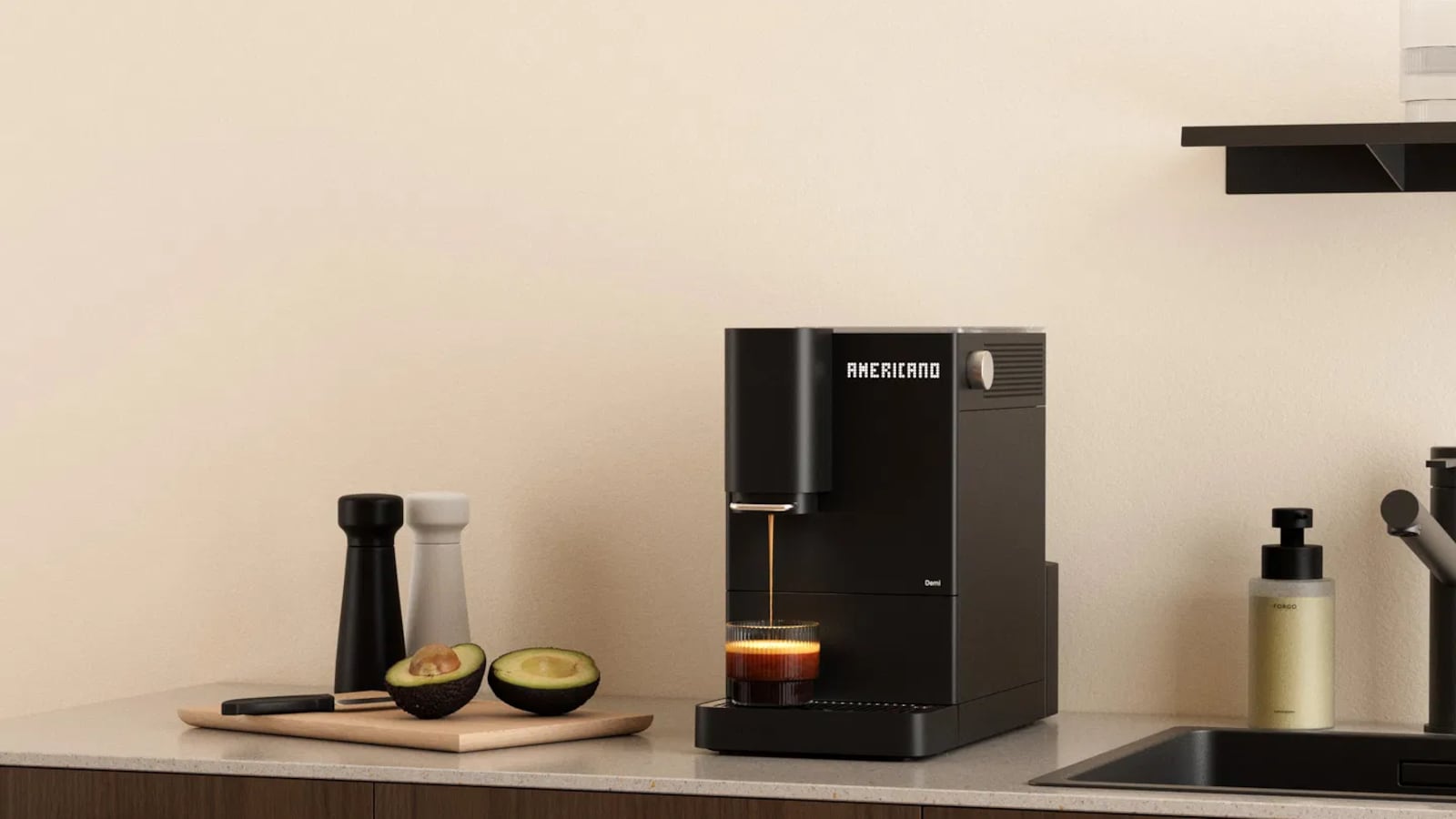Demi espresso machine from Terra Kaffe on a countertop next to a sink and a cutting board with an avocado