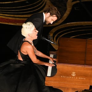 Lady Gaga and Bradley Cooper perform onstage at the iconic walnut Steinway during the 91st Annual Academy Awards in 2019.