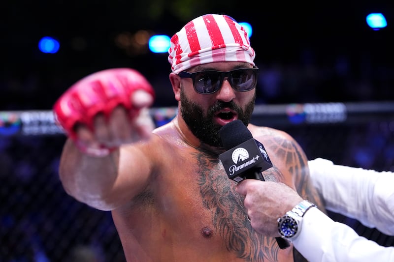 Josh Hokit speaks to Joe Rogan following his win in a heavyweight fight during the UFC Freedom 250 event on the South Lawn at the White House on June 14, 2026 in Washington, DC.