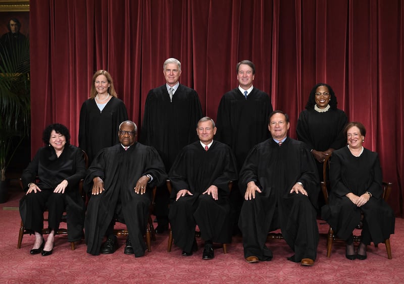 Justices of the US Supreme Court pose for their official photo at the Supreme Court in Washington, DC on October 7, 2022. (Seated from left) Associate Justice Sonia Sotomayor, Associate Justice Clarence Thomas, Chief Justice John Roberts, Associate Justice Samuel Alito and Associate Justice Elena Kagan, (Standing behind from left) Associate Justice Amy Coney Barrett, Associate Justice Neil Gorsuch, Associate Justice Brett Kavanaugh and Associate Justice Ketanji Brown Jackson. (Photo by OLIVIER DOULIERY / AFP) (Photo by OLIVIER DOULIERY/AFP via Getty Images)