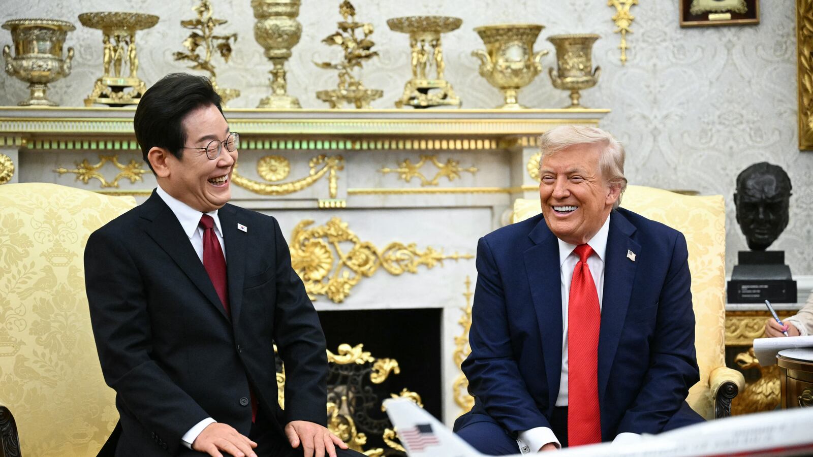 US President Donald Trump and South Korean President Lee Jae Myung attend a bilateral meeting in the Oval Office of the White House in Washington, DC, on August 25, 2025. Trump on Monday suggested that a "purge or revolution" was underway in South Korea, hours before new President Lee Jae Myung was due at the White House. He did not specify to what he was referring but said he would bring it up with Lee. (Photo by Mandel NGAN / AFP) (Photo by MANDEL NGAN/AFP via Getty Images)