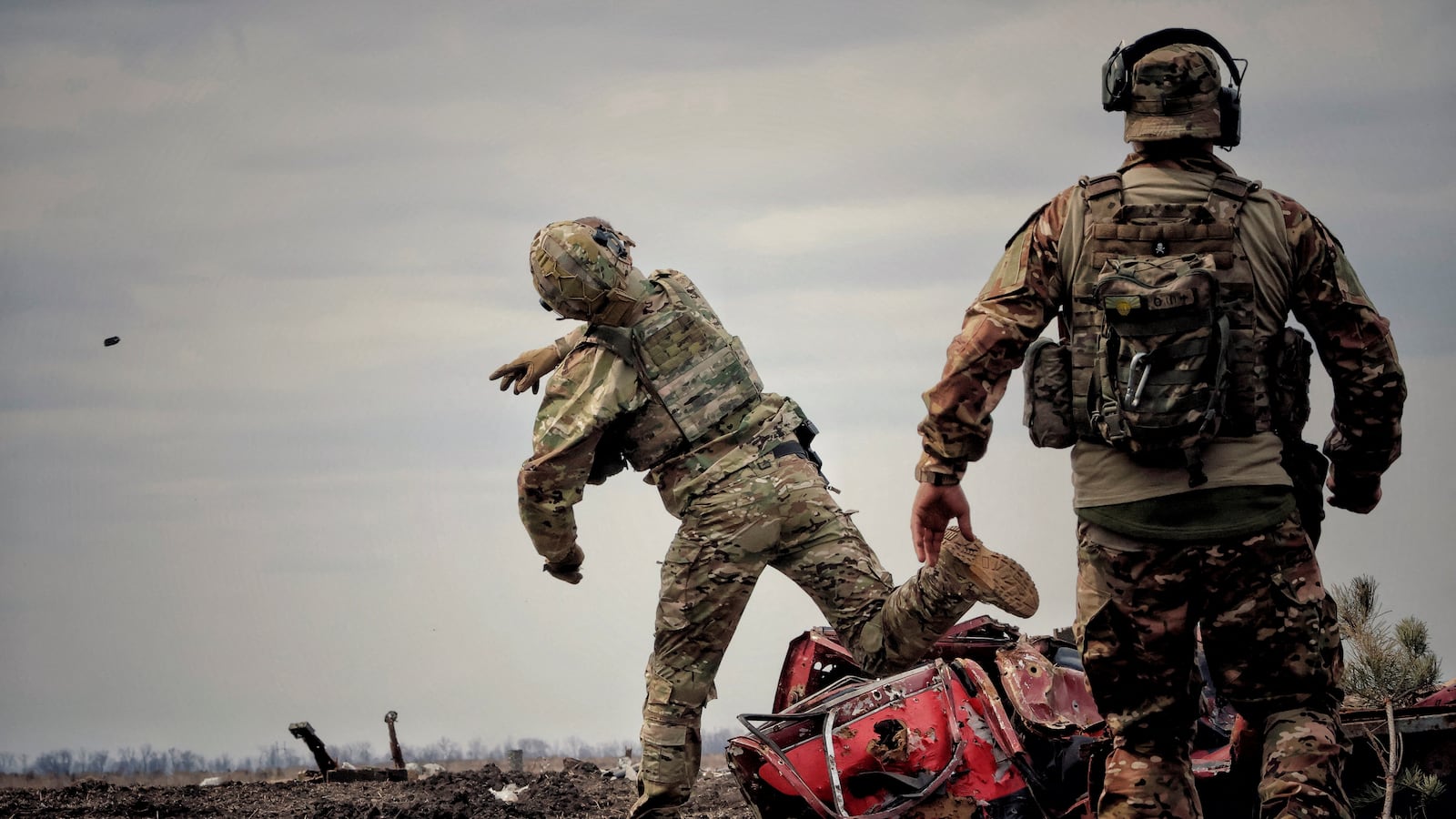 A Ukrainian soldier throws a grenade during training in the Donbas region
