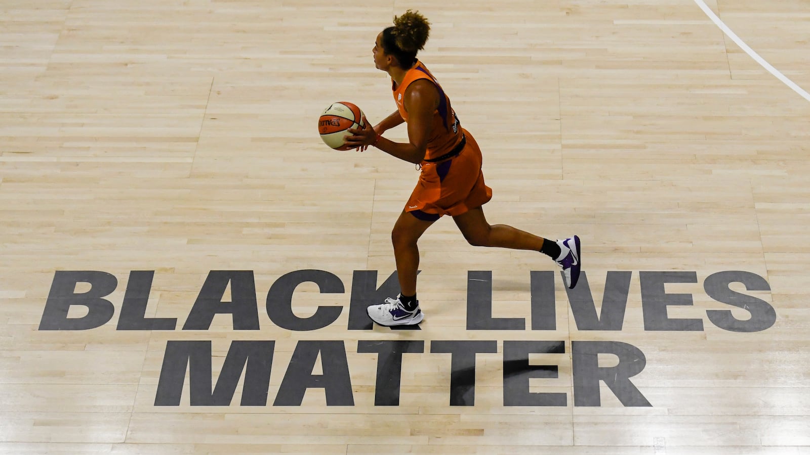 A Black Lives Matter sign painted on the floor at Feld Entertainment Center in Palmetto, Florida, in 2020.