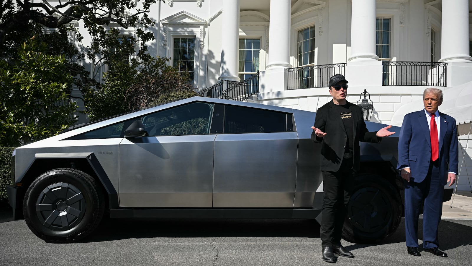 Elon Musk and Donald Trump in front of a Cybertruck