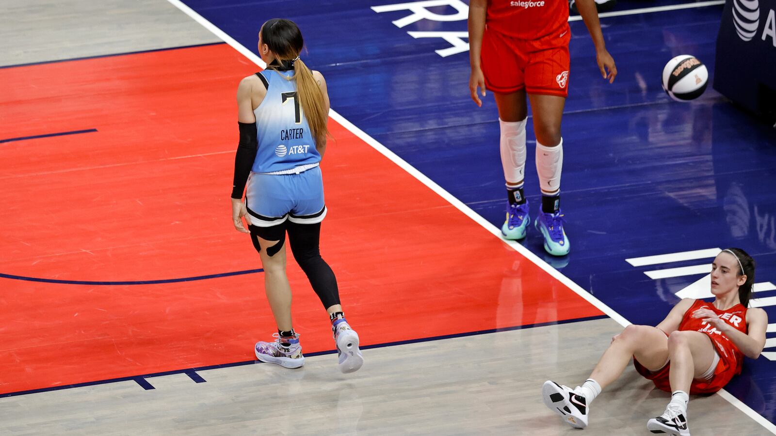 Chicago Sky guard Chennedy Carter (7) is whistled for a flagrant foul for knocking Indiana Fever guard Caitlin Clark (22) to the ground on June 1, 2024