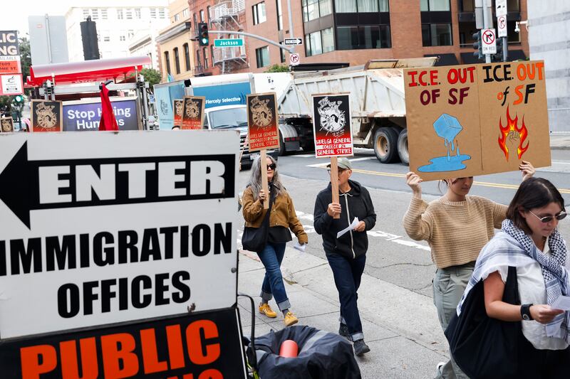 Demonstrators participate in a one-day work stoppage while protesting outside of the U.S. Immigration and Customs Enforcement San Francisco Field Office at 630 Sansome Street in San Francisco, California Friday, Oct. 24, 2025 following the news of federal agents arriving at Oakland's Coast Guard Island. (Photo by Jessica Christian/San Francisco Chronicle via Getty Images)