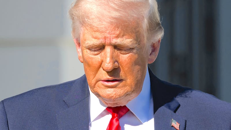 President Donald Trump walks towards reporters before boarding Marine One to depart from the White House in Washington, DC, on April 11, 2026.