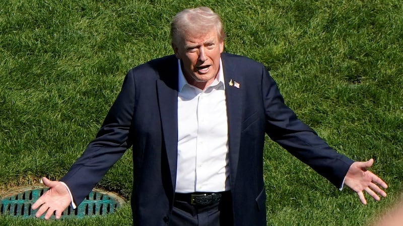 U.S. President Donald Trump gestures during the Ryder Cup at Bethpage Black Golf Course in Farmingdale, New York,  U.S., September 26, 2025. REUTERS/Elizabeth Frantz