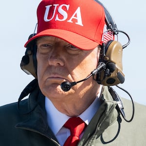 TOPSHOT - US President Donald Trump visits the USS George H.W. Bush aircraft carrier which is out at sea near Norfolk, Virginia, October 5, 2025, as he travels to see a Naval demonstration as part of the US Navy's 250th anniversary celebration, "America's Navy 250: Titans of the Sea - A Salute to the Fleet". (Photo by SAUL LOEB / AFP) (Photo by SAUL LOEB/AFP via Getty Images)