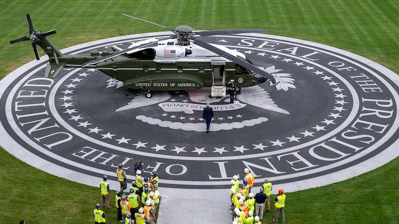 Donald Trump walks towards Marine One before departing from the White House's new helipad on the South Lawn for the first time on Sept. 21, 2026.