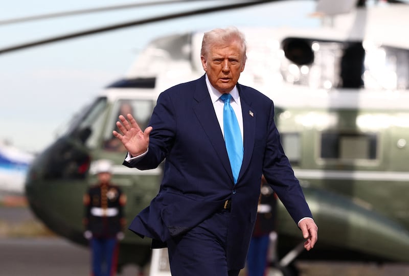 U.S. President Donald Trump walks from Marine One to board Air Force One to depart Haneda Airport for South Korea, in Tokyo, Japan, October 29, 2025. REUTERS/Evelyn Hockstein