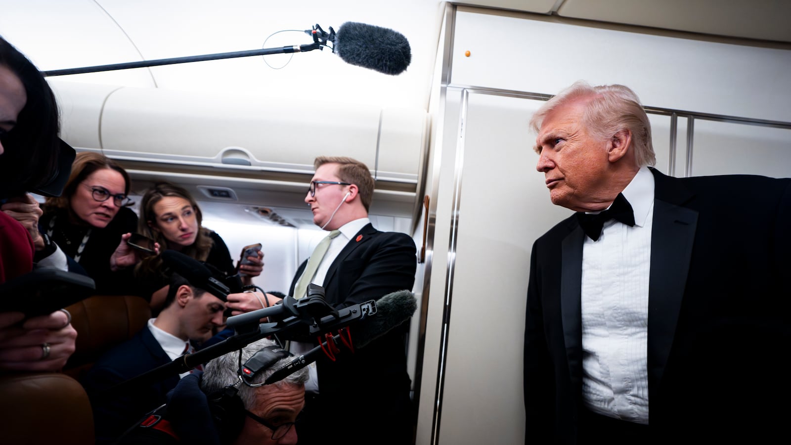 President Donald Trump speaks to reporters and members of the media on board Air Force One on January 31, 2026 while flying in between Washington and West Palm Beach, Florida.
