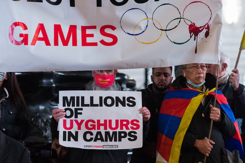 LONDON, UNITED KINGDOM - FEBRUARY 03, 2022: Hongkongers, Tibetans, Uyghur Muslims, their Tigrayan allies and supporters protest in Piccadilly Circus on the eve of Beijing 2022 Winter Olympic Games on February 03, 2022 in London, England. The demonstrators protest against the International Olympics Committee's (IOC) decision to award this year's Winter Olympics to China amid the country's record of human rights violations in Hongkong and Tibet as well as crimes against humanity against Uyghurs and other Turkic Muslims in the northwestern region of Xinjiang. (Photo credit should read Wiktor Szymanowicz/Future Publishing via Getty Images)