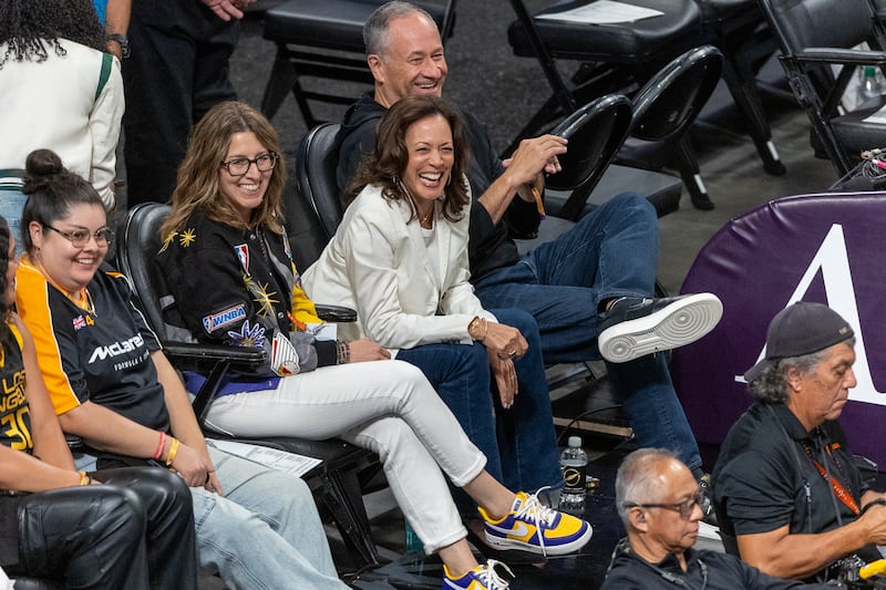 Harris and husband Doug Emhoff sit courtside during last Friday's game between the Chicago Sky and the Los Angeles Sparks in Los Angeles. Harris would later speak to the Sparks in their locker room.