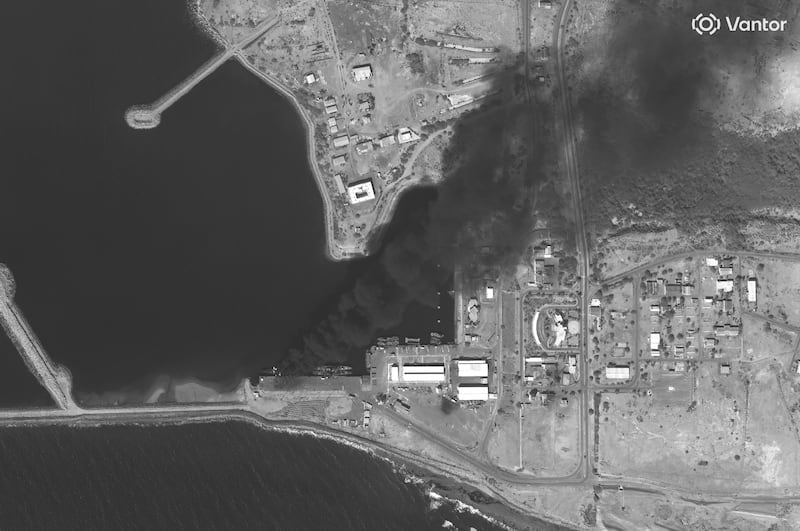 Vantor satellite image shows smoke rising from a burning vessel docked at Konarak Naval Base in southern Iran.