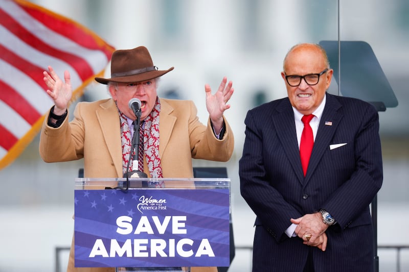 Chapman University law professor John Eastman, next to U.S. President Donald Trump's personal lawyer Rudy Giuliani, gestures as he speaks while Trump supporters gather ahead of his speech to contest the certification by the U.S. Congress of the results of the 2020 U.S. presidential election in Washington, U.S, January 6, 2021. REUTERS/Jim Bourg