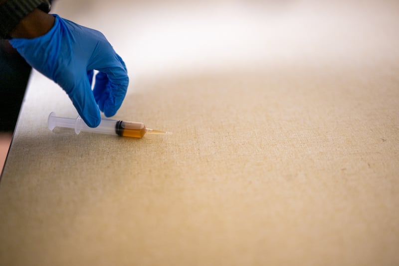 ST. PAUL, MINNESOTA - JANUARY 27: The syringe an individual used in an attempted attack on Rep. Ilhan Omar (D-MN) during a town hall meeting at the Urban League Twin Cities facility is seen on January 27, 2026 in Minneapolis, Minnesota. A person holding a syringe charged Omar's podium while she spoke to community members. Protests and demonstrations continue around Minneapolis in the aftermath of the killings of Alex Pretti and Renee Nicole Good by federal law enforcement.  (Photo by Brandon Bell/Getty Images)