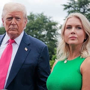 U.S. President Donald Trump, joined by White House Press Secretary Karoline Leavitt, speaks to the media as he departs the White House on July 15, 2025 in Washington, DC.