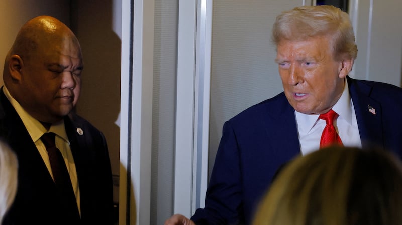 Steven Cheung listens to Donald Trump.