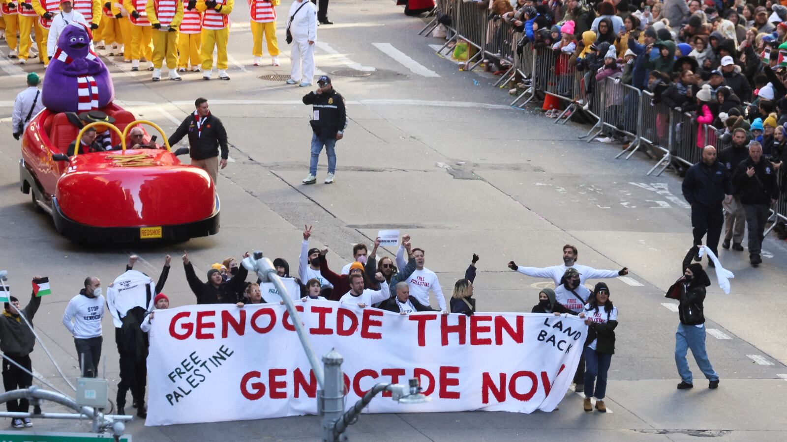 People demonstrate during the 97th Macy's Thanksgiving Day Parade, in Manhattan, New York City, U.S., November 23, 2023.