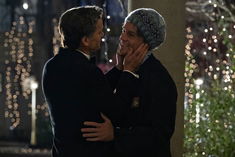 Matt Bomer and Jonathan Bailey hug in a still from ‘Fellow Travelers’