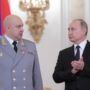 Russian President Vladimir Putin and Colonel General Sergei Surovikin, commander of Russian forces in Syria, attend a state awards ceremony for military personnel who served in Syria, at the Kremlin in Moscow, Russia December 28, 2017. Sputnik/Alexei Druzhinin/Kremlin via REUTERS ATTENTION EDITORS - THIS IMAGE WAS PROVIDED BY A THIRD PARTY.