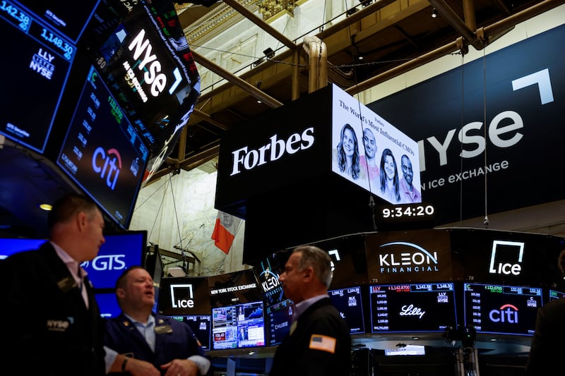 Forbes signage displays on the floor of the New York Stock Exchange (NYSE) in New York City, U.S., August 3, 2026. REUTERS/Jeenah Moon