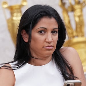 WASHINGTON, DC - MAY 30: White House Deputy Chief of Staff Stephen Miller's wife, Katie Miller, listens as U.S. President Donald Trump and Tesla CEO Elon Musk speak to reporters in the Oval Office of the White House on May 30, 2025 in Washington, DC. Musk, who served as an adviser to Trump and led the Department of Government Efficiency, announced he would leave his role in the Trump administration to refocus on his businesses. (Photo by Kevin Dietsch/Getty Images)