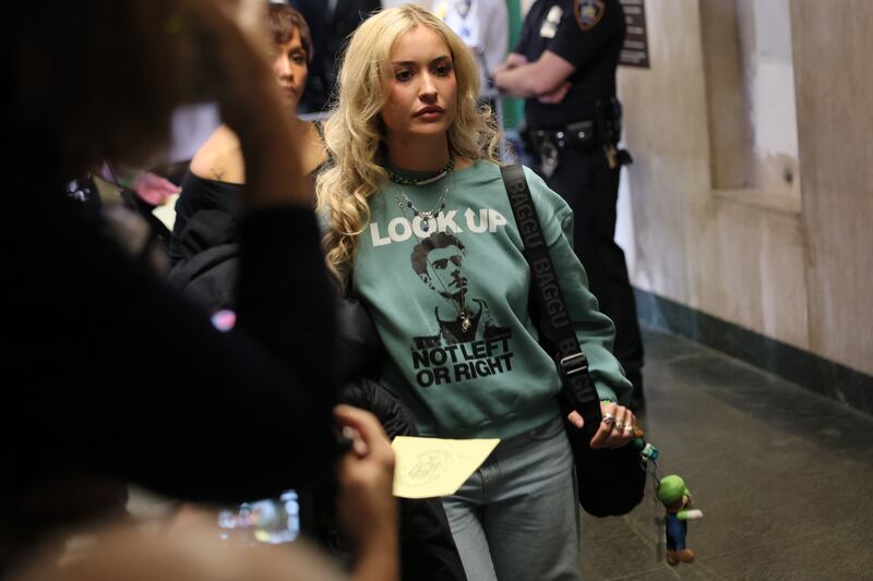 People enter the courtroom before a hearing for Luigi Mangione in Manhattan Criminal Court on December 01, 2025 in New York City.