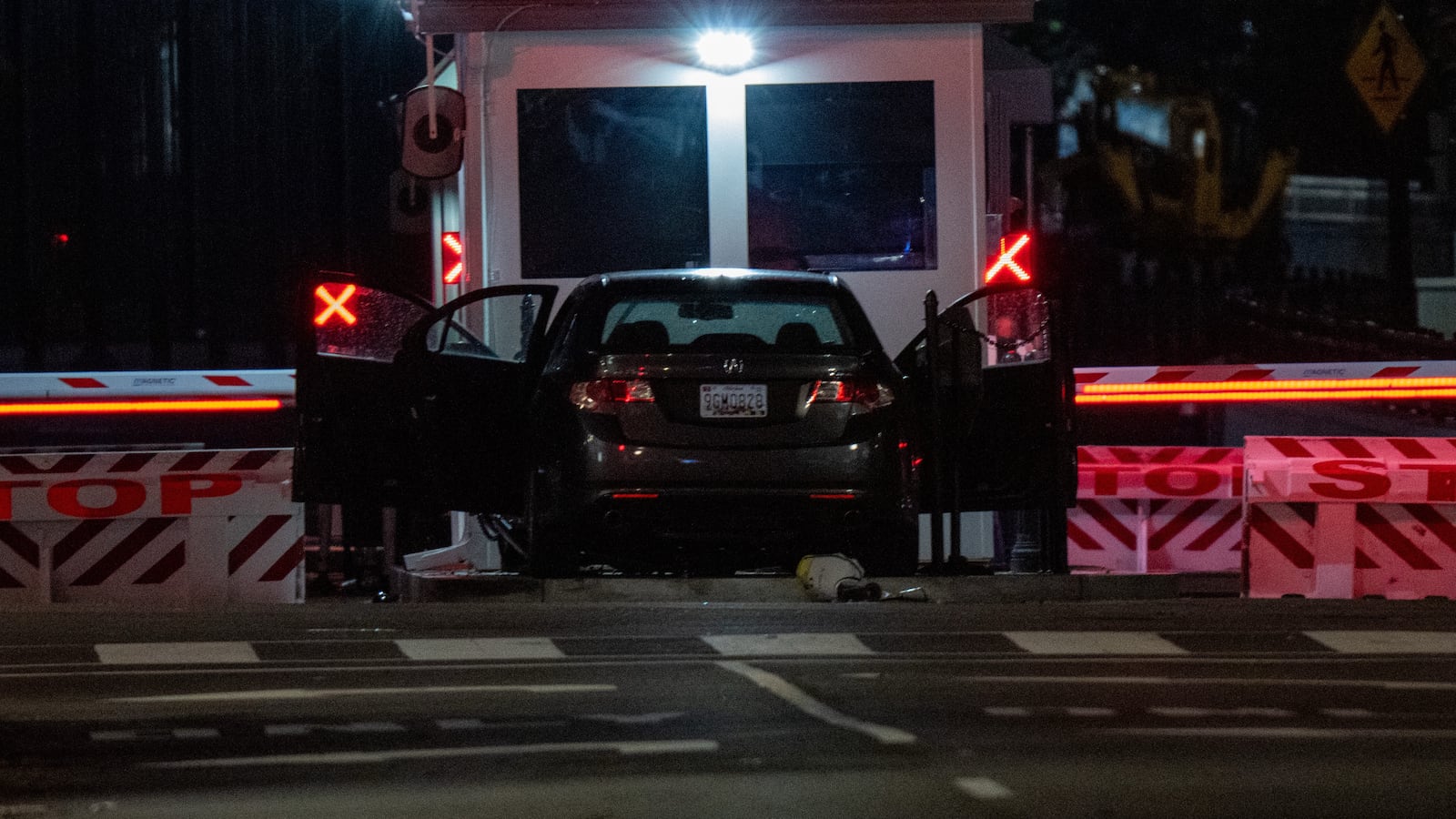 A vehicle is seen after ramming a security barricade at the White House complex