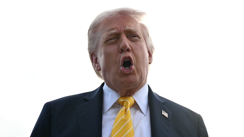 US President Donald Trump speaks with reporters at Palm Beach International Airport in West Palm Beach, Florida on May 2, 2026, before boarding Air Force One en route to Miami. (Photo by Jim WATSON / AFP via Getty Images)