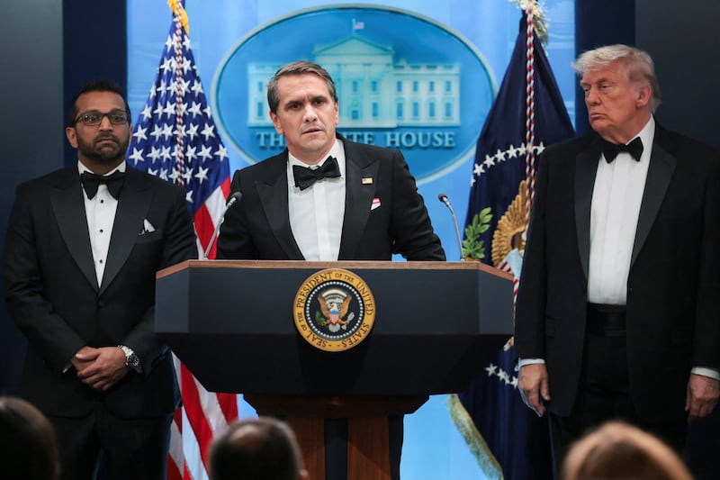 Acting Attorney General Todd Blanche speaks next to Federal Bureau of Investigation (FBI) Director Kash Patel and U.S. President Donald Trump, at a press briefing at the White House, following a shooting incident during the annual White House Correspondents’ Association dinner, in Washington, D.C., U.S., April 25, 2026 REUTERS/Jonathan Ernst