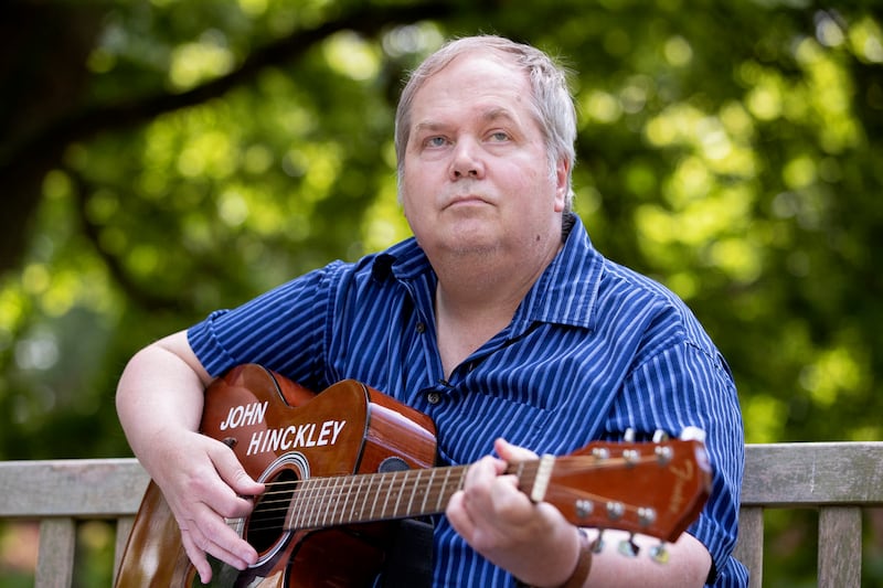 John Hinckley Jr. plays his guitar in Williamsburg, Virginia, on September 14, 2022. -