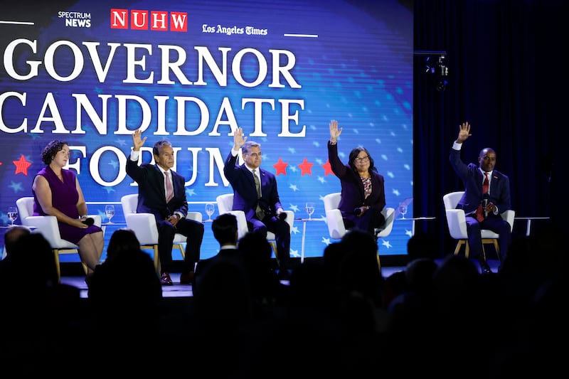 Los Angeles, CA - September 28: (From left) Former Congressmember Katie Porter, former Los Angeles Mayor Antonio Villaraigosa, former United States Health Secretary Xavier Bacerra, former State Controller Betty Yee and California Superintendent of Public Instruction Tony Thurmond raise their hands when answering a question at the NUHW Governor Candidate Forum at the Hyatt Regency Los Angeles International Airport on Sunday, Sept. 28, 2025 in Los Angeles, CA. (Carlin Stiehl / Los Angeles Times via Getty Images)