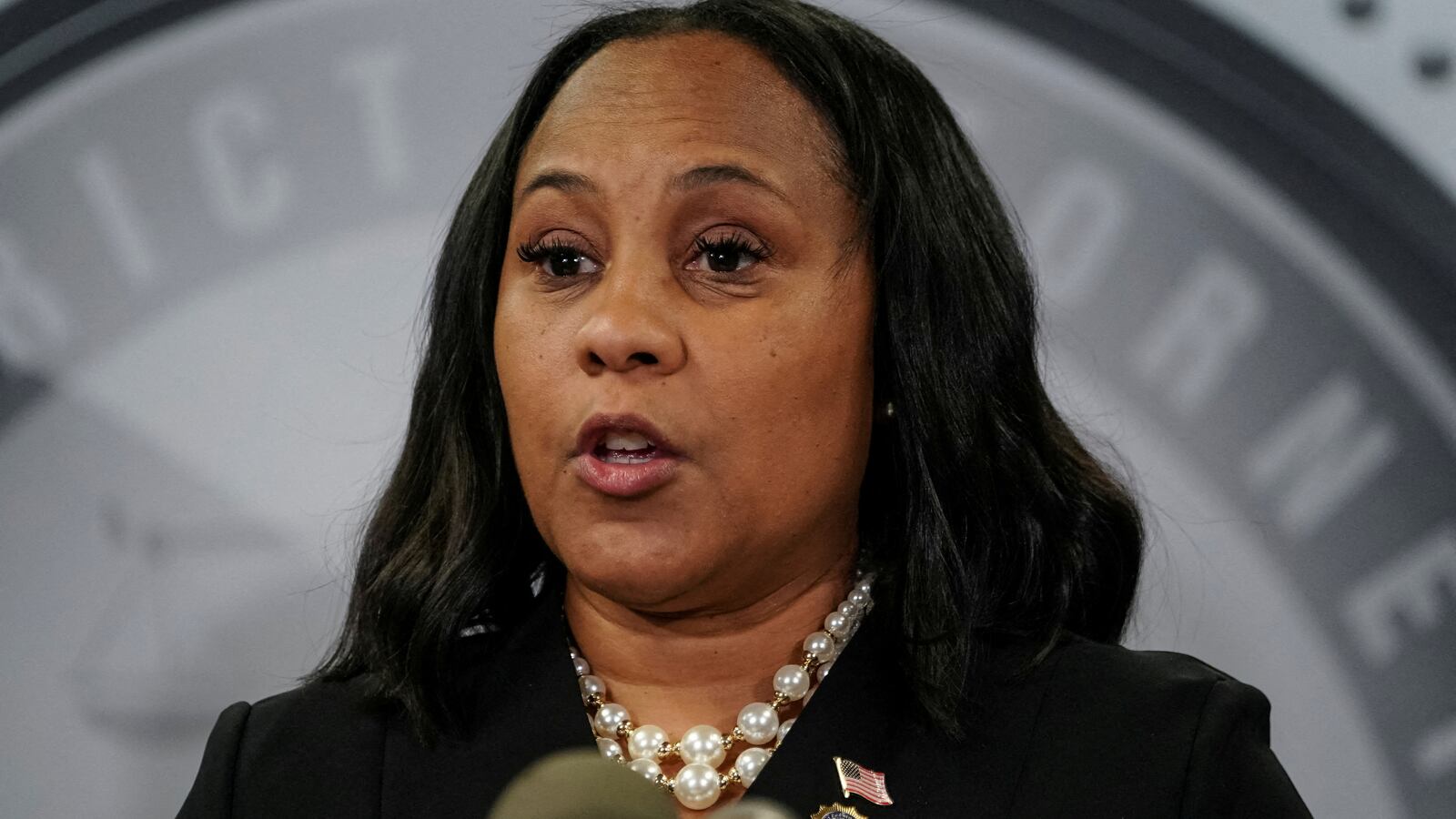 Fani Willis speaks to the media after a Grand Jury brought back indictments against former President Donald Trump and 18 of his allies