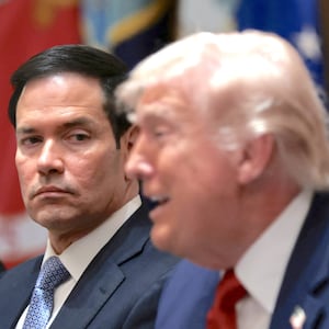 President Donald Trump speaks next to Secretary of State Marco Rubio during a cabinet meeting at the White House in Washington, D.C., U.S., March 26, 2026.