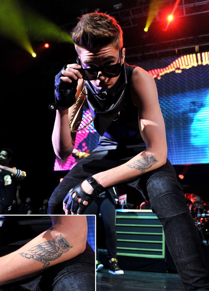 galleries/2013/05/02/justin-bieber-s-tattoos-a-selena-gomez-look-a-like-a-crown-jesus-ink-and-more/130429-justin-bieber-tattoos4_eo9uso