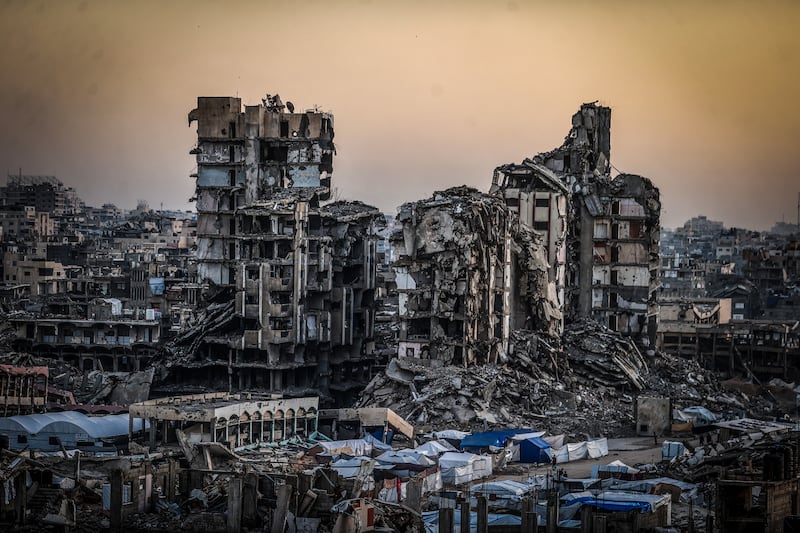 GAZA CITY, GAZA - FEBRUARY 22: Displaced Palestinians attend mass iftar program held among the rubble of buildings destroyed by Israel in Gaza Strip on February 22, 2026. (Photo by Ali Jadallah/Anadolu via Getty Images)