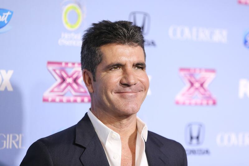 galleries/2013/12/20/biggest-celebrity-scandals-of-2013-miley-twerks-beyonce-lip-syncs-and-more/2013-celeb-scandal-cowell_cwwm0e