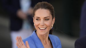 Britain's Catherine, Princess of Wales waves as she walks through the grounds on the fourth day of the 2026 Wimbledon Championships at The All England Lawn Tennis and Croquet Club in Wimbledon, southwest London, on July 2, 2026. (Photo by Andrew Matthews / POOL / AFP via Getty Images) / RESTRICTED TO EDITORIAL USE - No commercial use without prior written consent of the AELTC. Just still image use - no moving images to emulate broadcast. No superimposing or removal of sponsor/ad logos.