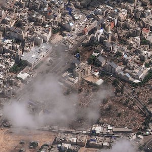 A photo including an overview of Al Ahli Hospital after explosion
