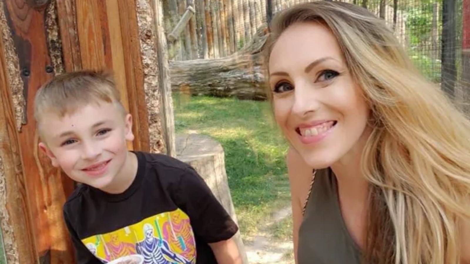 Emily Carroll and her son, Kellan, smile together. Cops say two were attacked by a pack of dogs on Saturday that killed Kellan and severely injured Emily.