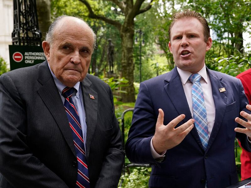 Former New York Mayor Rudy Giuliani campaigns with his son, Andrew, during his failed 2022 gubernatorial bid.