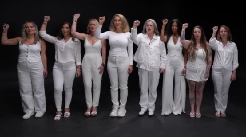 Rosie O’Donnell sings “I Am Woman” with survivors of Epstein.