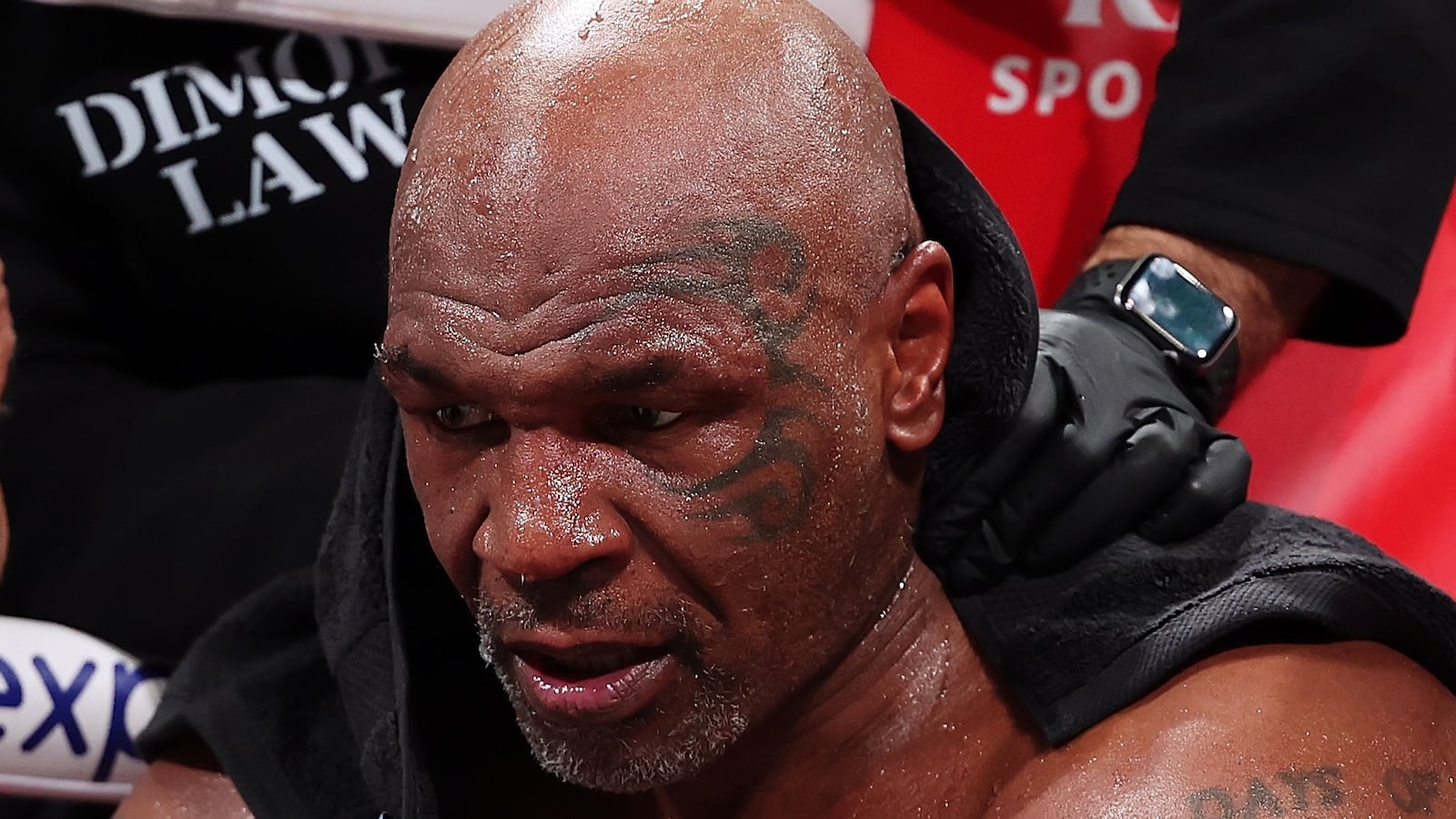 ARLINGTON, TEXAS - NOVEMBER 15: Mike Tyson fights during LIVE On Netflix: Jake Paul vs. Mike Tyson at AT&T Stadium on November 15, 2024 in Arlington, Texas. (Photo by Al Bello/Getty Images for Netflix © 2024)