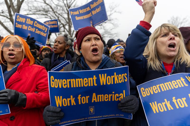 Members of the American Federation of Government Employees (AFGE) union protest against firings during a rally to defend federal workers  in Washington, DC on February 11, 2025.