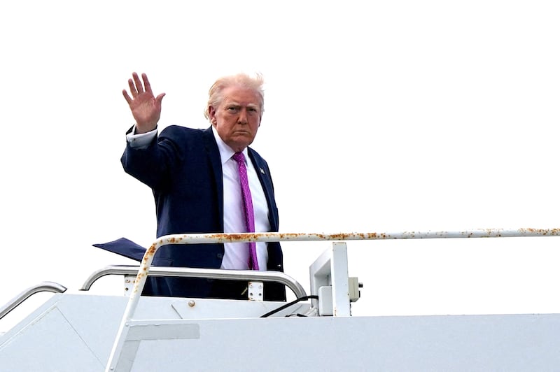 President Donald Trump waves as he boards Air Force One at Palm Beach International Airport in West Palm Beach, Florida, U.S., March 29, 2026.